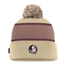 Get your young fan ready for the season with this Florida State Seminoles 2024 Sideline Peak Cuffed Knit Hat with Pom from Nike. This cuffed knit hat features embroidered graphics with raised details, showcasing the iconic Florida State Seminoles logo with intricate stitching. Topped with a playful pom, this hat effortlessly combines style and team spirit.  Made from 100% acrylic, the knit design offers warmth and comfort, ensuring your young fan stays cozy while cheering on the Seminoles. Nike Winter Beanie Hat, Florida State Seminoles Logo, Nike Gold, Florida State Seminoles, Florida State, Custom Embroidery, Knit Hat, Free Shopping, Team Spirit