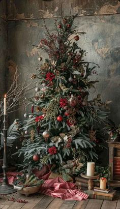 a decorated christmas tree with red and silver ornaments