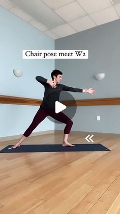 a woman is standing on a yoga mat