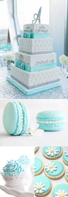 blue and white wedding cake, cupcakes, and cookies on display at a reception