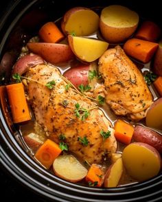 chicken, potatoes and carrots in a slow cooker