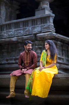 a man and woman sitting next to each other