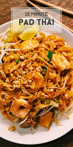 a white plate topped with pad thai noodles