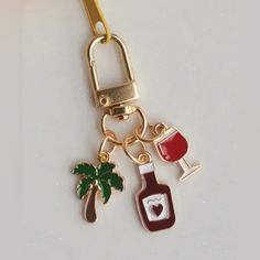 a bottle of wine and a glass on a keychain