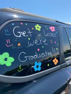 a car that has been decorated with flowers and the words get lost, we're graduating