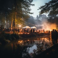 a group of people standing around a fire pit in the middle of a forest at night