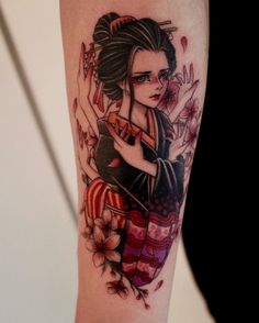 a woman with an american flag tattoo on her arm and leg, holding a knife