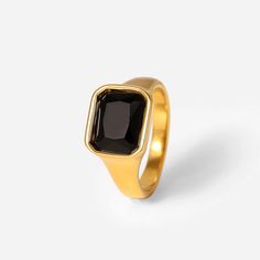 Introducing the Forza Gold Black Gemstone Signet Ring, a dazzling fusion of elegance and modern style. Crafted from high-quality stainless steel with a luxurious 18 karat gold finish, this ring exudes sophistication. The on-trend square-ish design, paired with a sparkling array of gemstone options including black, clear, pink, and green zircons, adds a touch of glamour to any ensemble. Whether you're looking for a statement piece or a stylish gift, the Forza Gold Gemstone Signet Ring is a radian Formal Rectangular Stainless Steel Signet Ring, Formal Stainless Steel Rectangular Signet Ring, Modern Rectangular Stainless Steel Signet Ring, Modern Stainless Steel Rectangular Signet Ring, Modern Stainless Steel Signet Ring For Anniversary, Modern Signet Ring With Rectangular Stone For Formal Occasions, Modern Square Ring With Polished Finish, Modern Gold Square Signet Ring, Modern Square Cut Signet Ring For Formal Occasions