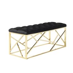 a black and gold bench with an upholstered seat on it's side