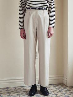 This product exemplifies modern sophistication with a minimalist design that complements a variety of styles. The Light Semi-Wide Cotton Pants are tailored to offer a comfortable, semi-wide fit that flatters the form while allowing for ample movement. With their crisp lines and structured fabric, these pants present a polished aesthetic suitable for both formal and casual settings. - Crafted from premium cotton, these pants offer breathability and comfort for all-day wear.- The semi-wide cut of these trousers ensures a contemporary look with a hint of relaxed elegance.- Equipped with a clean waistline and discreet pockets, the design maintains a sleek and uncluttered profile.- A concealed closure system adds to the seamless look, enhancing the garment's modern charm. Modern Beige High-waisted Wide Leg Pants, Modern Ankle-length Wide Leg Pants For Spring, Modern Beige Straight Leg Bottoms, Modern Relaxed Fit Dress Trousers, Modern Relaxed Fit Pants For Spring, Relaxed Fit Modern Pants For Office, Modern Relaxed Fit Pants For Office, Modern Tailored Wide Leg Pants For Spring, Modern Fitted Beige Wide Leg Pants