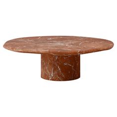 a round marble table with a brown base and white veining on the top, against a white background