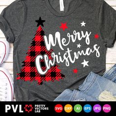 a t - shirt that says merry christmas with a tree on the front and stars around it