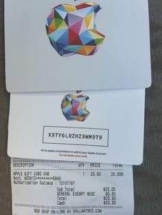 an apple gift card and receipt sitting on top of each other in front of a computer screen