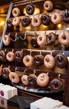 doughnuts are hanging on the rack and ready to be eaten