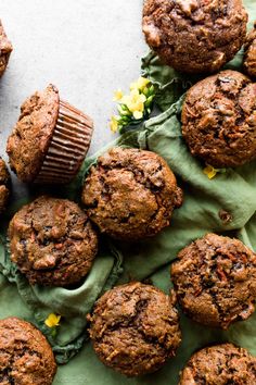 chocolate muffins and a cupcake on a green napkin