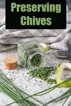 there are some herbs on the counter next to a knife and fork, with text overlay that reads preserver chives