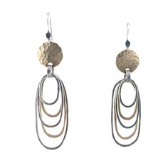 Gold & Silver Earrings - These silver and 14k gold-filled hoops are shaped by hand, then hammered and oxidized to emphasize their distressed look. Lightweight and comfortable, their silver and gold mix takes them easily from day into night. Sterling silver ear wires. Gold Filled Hoops, Artful Home, Disc Earrings, Oval Earring, Metal Earrings, Ear Wires, Precious Metals, Gold Filled, Silver Gold