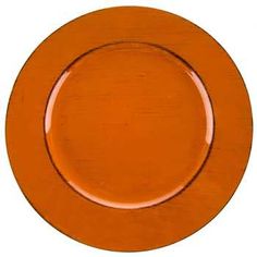 an orange plate on a white background