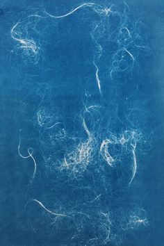 an abstract blue painting with white lines on it