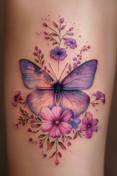 a woman's stomach with a butterfly and flowers on it