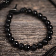 Men's beaded leather mala bracelet.  This piece consists of black onyx gemstone beads (8mm) and a pewter clasp bead, strung on high quality durable black leather.  I use a bead and loop style clasp which is secure and guaranteed to stay clasped. Rugged, timeless, and durable... as a man's bracelet should be. I use only the highest quality leather cord available on the market. It obtains its color through a natural dye process, which enables it to maintain its rich, natural leather look and feel. Leather Cord Bracelets, Beads Mala, Jewelry Design Drawing, Mala Bracelet, Mens Leather Bracelet, Onyx Gemstone, Gemstone Beaded Bracelets, Mens Beaded Bracelets, Onyx Bead