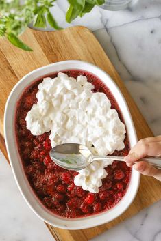 someone is spooning cottage cheese into a bowl