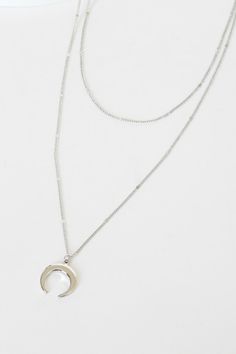 Make your trendy girl dreams a reality with the Lulus Hopeful Moments Silver Moon Layered Necklace! Two layers of dainty silver chains work together to create a minimalist chic vibe across this darling necklace with a shiny silver, crescent moon charm. Lobster clasp closure. Shortest necklace measures 11" long with a 4" extender chain. Brass and steel. Imported. Lulus | Hopeful Moments Silver Moon Layered Necklace. Silver Minimalist Layered Necklace With Double Chain, Chic Silver Layered Necklace For Gift, Trendy Silver Necklace With Moon Charm, Trendy Silver Jewelry With Moon Charm, Trendy Silver Moon Jewelry, Silver Everyday Layered Necklace, Silver Layered Necklace For Everyday, Silver Minimalist Layered Necklace With Round Pendant, Chic Silver Layered Necklace With Adjustable Chain