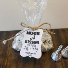 a bag of hers and kisses next to it's packaging on a wooden table