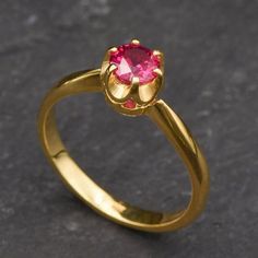 Gold Ruby Ring set with a Created Ruby in a flawless diamond cut & deep red color, at 5mm (0.6 Cts).Gold Vermeil: 18k Gold over Solid 925 Sterling Silver ☞ made to last.Click here for ☞ Matching PendantMatching Earrings ☞ please ask meClick here for ☞ Ruby Jewelry CollectionDetails:• Created Ruby in a flawless clarity• Ruby: 5mm, 0.6 Ct, diamond cut• Band width ≈ 2.3mm, thickness ≈ 1.2mm• 18k Gold VermeilSKU 2773 Ruby Ring Engagement, Ruby Promise Ring, Red Diamond Ring, Ruby Ring Set, Gold Ruby Ring, White Gold Promise Ring, July Birthstone Ring, Ruby Bands, Ruby Ring Gold