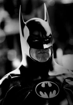 black and white photo of batman in costume