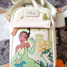 Disney Princess Jasmine Crossbody Bag. Super Nice With A Large Zipper Compartment And A Smaller Zipper Compartment On The Front. It Has An Adjustable Strap And Is Made Of A Soft Leather. Disney Style Crossbody Shoulder Bag With Adjustable Strap, Disney White Bags For Disney Trips, Disney Style Shoulder Bag With Removable Pouch, Disney Crossbody Bags For Disney Trips, Disney White Travel Shoulder Bag, Disney Style Crossbody Bags For Disney Trips, Disney Style White Shoulder Travel Bag, Disney Canvas, Adjustable Strap Bag