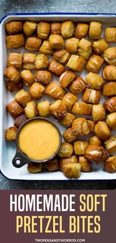 homemade soft pretzel bites in a baking dish with dipping sauce on the side