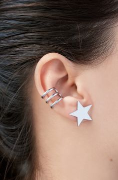 D E T A I L S These Star stud earrings are made of 18k Gold plated /White gold plated copper. These earrings are sold as a pair. The listing is only for the star earrings ( it does not include the cartilage cuff). S I Z E These earrings are approx 0.75x0.75 inch / 2x2 cm C A R E * I N S T R U C T I O N S Remove your jewelry before swimming, bathing, or exercising. Put on your jewelry after cosmetics, perfume, and lotions have been absorbed. Use a soft microfiber cloth to wipe your jewelry after Silver Star Clip-on Earrings For Gift, Silver Star-shaped Pierced Cartilage Earrings, Silver Star-shaped Cartilage Earrings With Pierced Design, Trendy Silver Star Earrings, Trendy White Ear Cuff, Trendy White Single Ear Cuff, Trendy Silver Ear Cuff With Matching Earrings, Silver Star-shaped Ear Cuff As Gift, Silver Star-shaped Ear Cuff For Gift