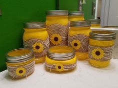 mason jars with sunflowers painted on them