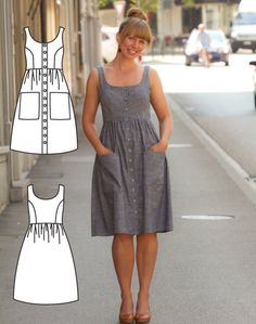 a woman is standing on the sidewalk in front of a building and wearing a dress with buttons