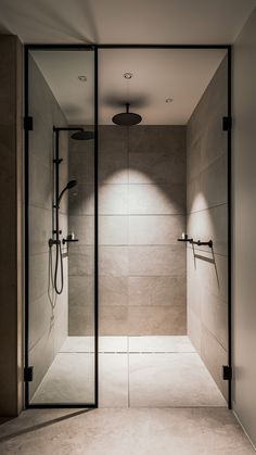 a walk in shower sitting inside of a bathroom