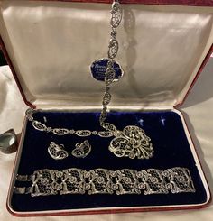 "Beautiful Sterling Danecraft set includes bracelet, necklace & earring. The pattern is Florentine Lace. Original box is also included.  The necklace is 21\" end to end. The heart pendant is 2 1/4\" x 2 1/4\".  The bracelet is 7 1/4\" x 1 1/4\". Screwback earrings are 1\".  Total weight is 136 grams.  Rare find!  Condition is excellent." Classic Heart Jewelry For Collectibles, Classic Heart-shaped Collectible Jewelry, Classic Heart Shaped Collectible Jewelry, Elegant Filigree Jewelry For Valentine's Day, Victorian Hallmarked Formal Jewelry, Victorian Jewelry With Intricate Design For Collectors, Antique Heart-shaped Jewelry For Formal Occasions, Hallmarked Heart-shaped Victorian Jewelry, Antique Heart Shaped Jewelry For Formal Occasions