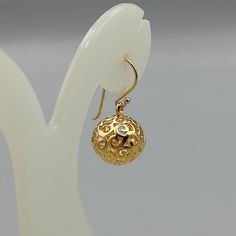 ONE PAIR of filigreed sterling silver ball danglers plated in real gold. Dimensions: 13 mm. Drop length: 28mm These earrings are made of 925 hypoallergenic sterling silver plated in gold. Sent in a gift box. I can include a personal message from you if needed You are welcome to contact me at... bhavnakwintra1956@gmail.com For more beautiful pieces from my shop, please browse 👇 TOE RINGS: https://www.etsy.com/your/shops/TheSilverGame/tools/listings/section:27020628,view:table EAR HOOPS: https:// Gold Danglers With Intricate Design In Brass, Gold Plated Filigree Earrings For Diwali, Traditional Gold Plated Filigree Danglers, Traditional Gold-plated Filigree Danglers, Gold Sphere Single Earring, Silver Tassel Earrings, Silver Strand, Evil Eye Earrings, Earrings Christmas