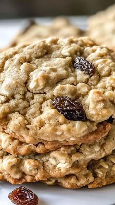 oatmeal raisin cookies stacked on top of each other with raisins