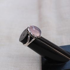 Gemstone - rose quartz Gemstone Size - 10x14 oval Metal - Sterling Silver Natural rose quartz sterling silver ring To change the ring size i request the buyer to pull the band lock in the opposite direction. The ring can be customized on request and gemstone can be switched to any gemstone you want. Feel free to contact me for any queries regarding jewelry for bulk order please contact me through messages. The ring will be a gift wrapped in a premium handmade jewelry box. Solitaire Oval Cabochon Jewelry As Gift, Adjustable Oval Crystal Ring For Formal Occasions, Solitaire Oval Cabochon Ring As Gift, Oval Cabochon Solitaire Ring As Gift, Rose Quartz Anniversary Rings, Oval Cabochon Solitaire Ring For Gift, Oval Cabochon Crystal Ring As Gift, Solitaire Oval Cabochon Ring For Gift, Elegant Oval Cabochon Crystal Ring Gift