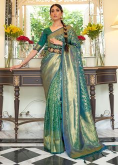 DEEP SEA GREEN KANJIVARAM SILK 204005 Desc: A bespoke saree with surreal charm in radiant shade with intricate zari work all over the drape. we added a touch of glamour with a stunning palla and tassel . Ideal for any special occasions!Saree Length : 5.5 meterBlouse Piece :  0.8 meterFabric : Blended kanjivaram silk . With Express Free Shipping Buy Indian Party wedding wear Kanchipuram Silk Saree DEEP SEA GREEN KANJIVARAM SILK 204005 online in USA, UK and Canada from KollyBollyEthnics.com Kanjivaram Sarees Silk, Indian Bridal Sarees, Kanjivaram Silk Saree, Handloom Fabric, Wedding Saree Indian, Green Saree, Saree Trends, Art Silk Sarees, Kanjivaram Sarees