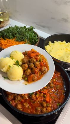 the meal is prepared and ready to be eaten on the stove with other dishes in the background