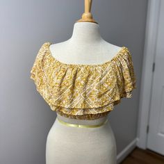 New Altar’d State Off The Shoulder Ruffle Layered Flounce Bahar Summer Top Sz S This Is Such An Adorable Summer Cropped Top Especially Paired With Jeans Or Jean Shorts. I Just Love The Golden Yellow And Jean Combo. Cute Top That Can Be Worn On The Shoulders Or Off. Lots Of Ruffles That Serve As Sleeves For The Perfect Boho Vibe. Color: Golden Mustard Yellow And Ivory Condition: This Is New Without Tags. The Plastic Thing Is Still Attached But The Tags Fell Off. Never Worn Size: Small Armpit To P Yellow Ruffled Top For Beach, Yellow Crop Top For Day Out, Yellow Floral Print Crop Top For Day Out, Fitted Yellow Floral Print Crop Top, Summer Cropped Top, Summer Crop Tops, Yellow Cream, Altard State, Altar'd State