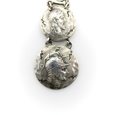 This is part of Chairish’s Costume Jewelry assortment.  This sterling silver fob features four graduated homeric medallions, dangling from a dog clip. Designed by George Shiebler, circa 1890’s, the piece was originally a watch fob; in contemporary use it makes a dramatic pendant when worn on a chain, or is great for a modern day watch enthusiast. The medallions are hand-hammered, with an ancient and cracked look to them—meant to make the piece look like it had come out of the many archaeological Collectible Historical Jewelry With Antique Finish, Historical Silver Jewelry As A Gift, Collectible Antique Finish Historical Jewelry, Victorian Silver Coin Pendant Jewelry, Antique Silver Coin Pendant Jewelry, Antique Silver Jewelry With Coin Pendant, Sterling Silver Medallion Jewelry With Antique Finish, Historical Silver Medallion Jewelry, Historical Engraved Medallion Jewelry