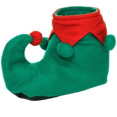 a green christmas stocking with a red hat on it's head and two legs