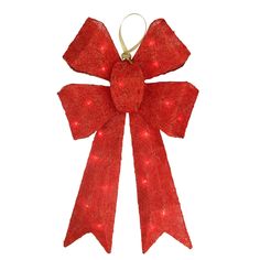 a red bow ornament with lights on it