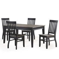 a dining room table and chairs with one chair up against the other, all in black