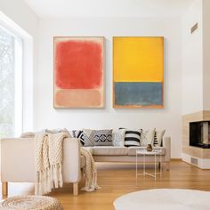 a living room with two paintings on the wall