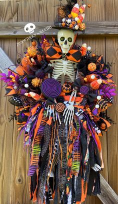 a halloween wreath with a skeleton on it