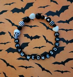 Totally obsessed with the new Netflix series like me?! Which team are you on? Dark, gothic vibes like Wednesday or Rainbow Candy vibes like Enid? Pick a team!   Me? I'm a fabulous mix of both! ️🤣 Wednesday Adams Accessories, Enid And Wednesday Party Ideas, Wednesday Addams Bracelet, Halloween Themed Black Bracelet, Black Halloween Themed Bracelet, Black Themed Bracelet For Halloween, Gothic Black Wristband For Halloween, Handmade Black Wristband For Halloween, Black Grunge Bracelets For Gifts